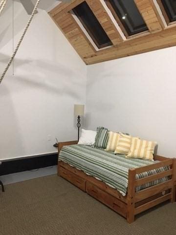 2111/2 Bradford St, Provincetown, MA 02657 - bedroom with carpet flooring and vaulted ceiling