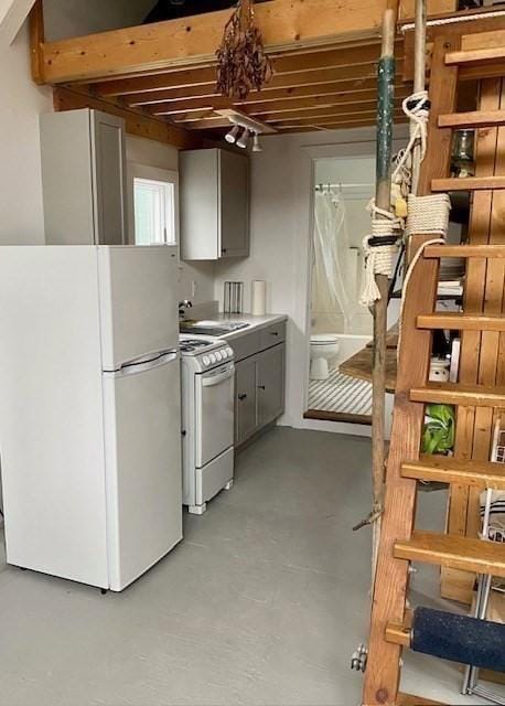 2111/2 Bradford St, Provincetown, MA 02657 - kitchen featuring white appliances, concrete floors, and a sink
