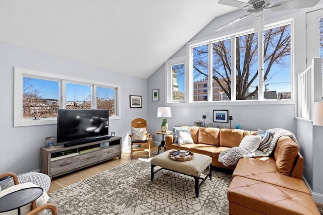 2111/2 Bradford St, Provincetown, MA 02657 - living area with vaulted ceiling, light wood finished floors, a ceiling fan, and baseboards