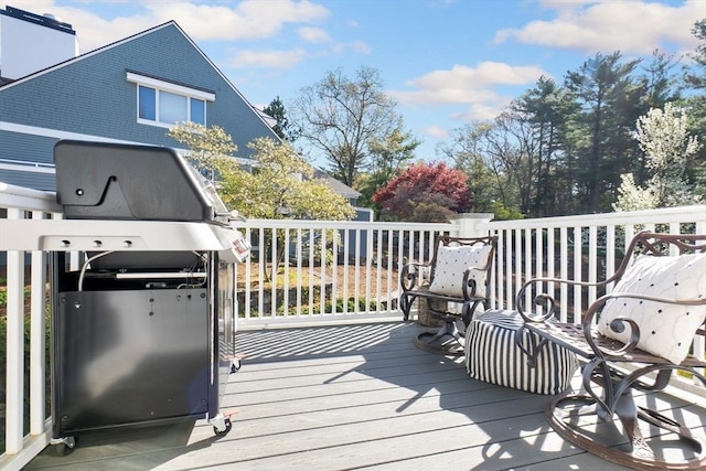 wooden deck with grilling area