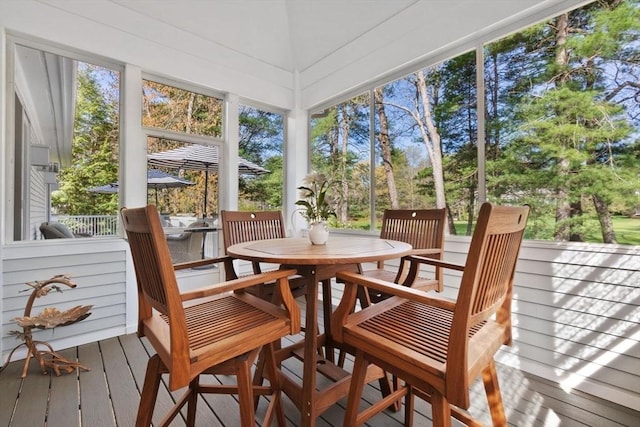 sunroom / solarium with outdoor dining space