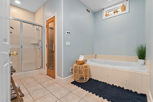 full bath featuring a bath, visible vents, tile patterned flooring, a stall shower, and baseboards