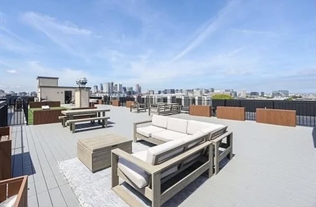 457 W Broadway Unit 209, Boston, MA 02127 - wooden deck with an outdoor hangout area and a skyline view
