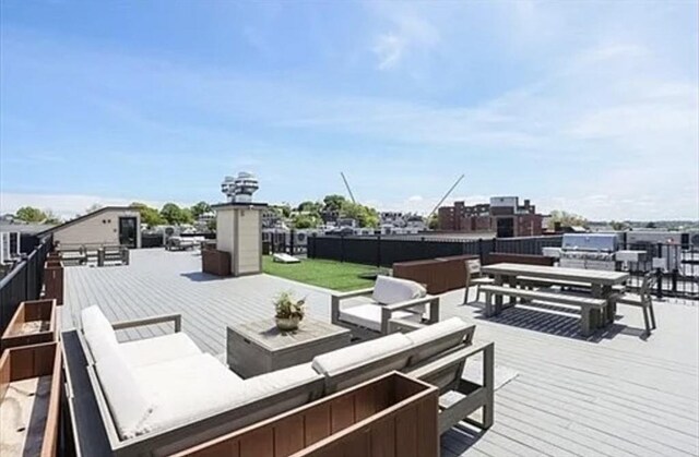 457 W Broadway Unit 209, Boston, MA 02127 - wooden deck with an outdoor living space