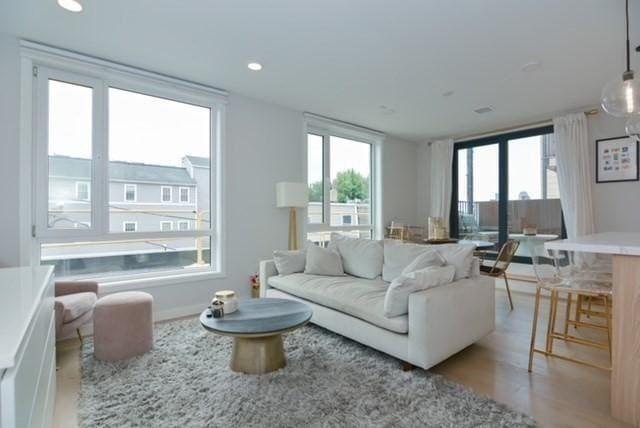 457 W Broadway Unit 209, Boston, MA 02127 - living room with healthy amount of natural light, light wood finished floors, and recessed lighting