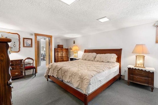 carpeted bedroom with a textured ceiling