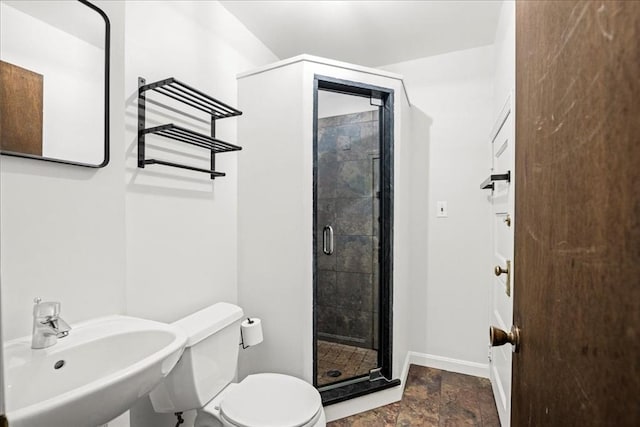 7 Vancroft Ave, Shrewsbury, MA 01545 - bathroom featuring a sink, toilet, baseboards, a stall shower, and stone tile flooring