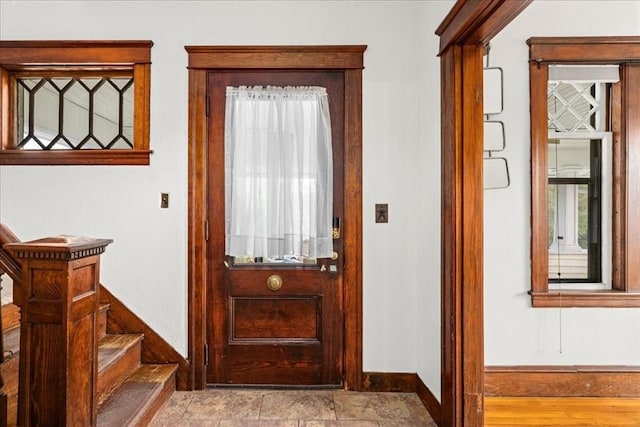 7 Vancroft Ave, Shrewsbury, MA 01545 - doorway to outside with a healthy amount of sunlight, baseboards, and stairway