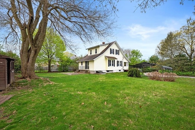 7 Vancroft Ave, Shrewsbury, MA 01545 - view of home's exterior with a yard, fence, a chimney, and a detached carport