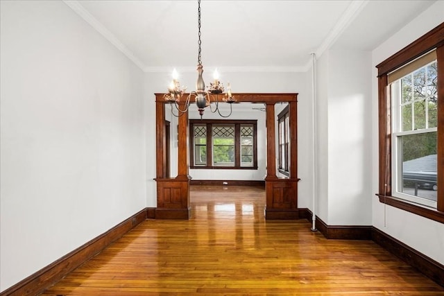 7 Vancroft Ave, Shrewsbury, MA 01545 - unfurnished dining area featuring baseboards, a chandelier, hardwood / wood-style flooring, and a healthy amount of sunlight