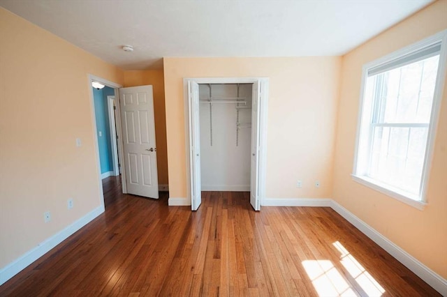 20 Warner Rd, Townsend, MA 01469 - unfurnished bedroom featuring baseboards, a closet, and hardwood / wood-style floors