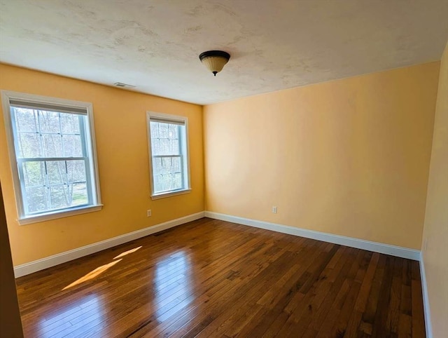 20 Warner Rd, Townsend, MA 01469 - spare room featuring baseboards, dark wood-style floors, and visible vents