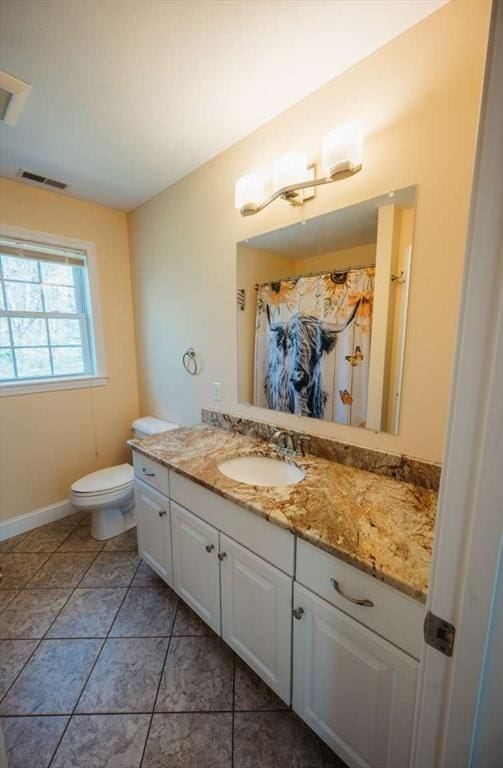 20 Warner Rd, Townsend, MA 01469 - full bath with vanity, baseboards, toilet, and visible vents