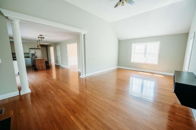 20 Warner Rd, Townsend, MA 01469 - unfurnished living room featuring ornate columns, a ceiling fan, light wood-style flooring, and baseboards