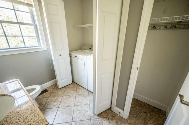 20 Warner Rd, Townsend, MA 01469 - laundry room with laundry area, baseboards, light tile patterned floors, and washer and dryer