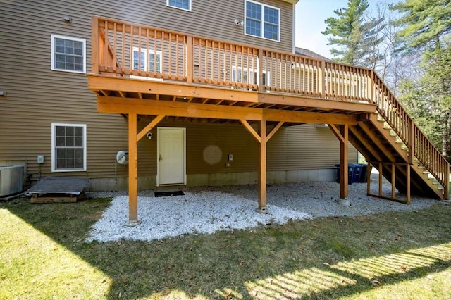 20 Warner Rd, Townsend, MA 01469 - back of property featuring a lawn, cooling unit, a wooden deck, and stairs