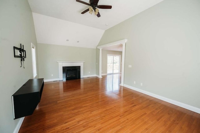 20 Warner Rd, Townsend, MA 01469 - unfurnished living room featuring baseboards, a fireplace, a ceiling fan, and light wood-type flooring