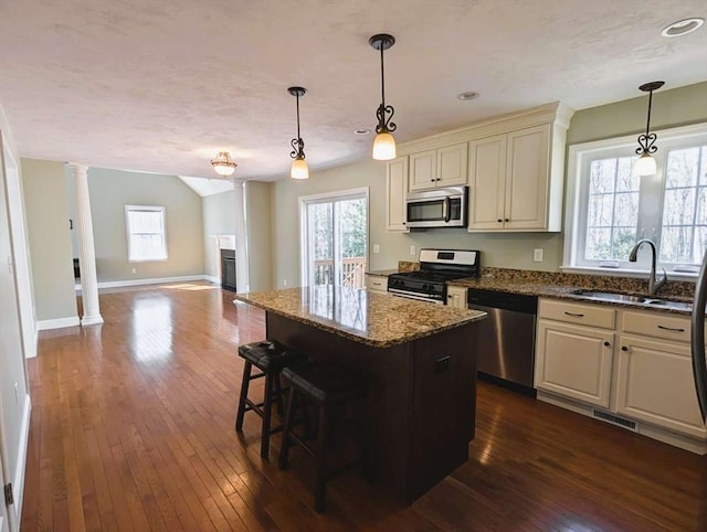 20 Warner Rd, Townsend, MA 01469 - kitchen with appliances with stainless steel finishes, a sink, baseboards, open floor plan, and dark wood-type flooring