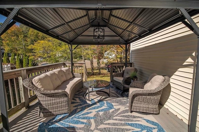 wooden terrace featuring a gazebo and an outdoor hangout area