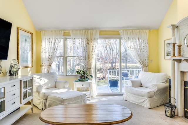 sitting room featuring vaulted ceiling