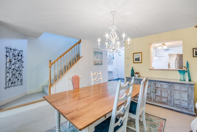 carpeted dining room with a notable chandelier