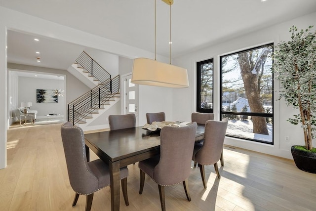 dining area with light hardwood / wood-style flooring