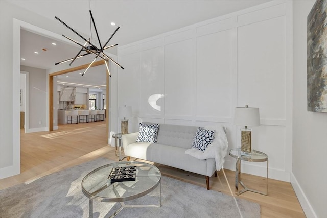 living room featuring hardwood / wood-style floors and a chandelier