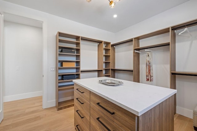 spacious closet featuring light wood-type flooring