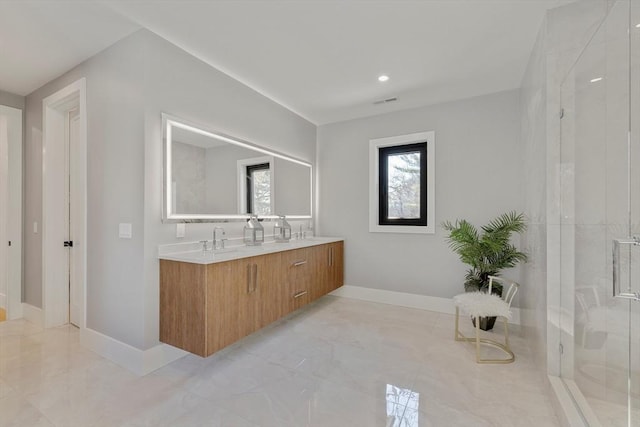 bathroom featuring vanity and walk in shower