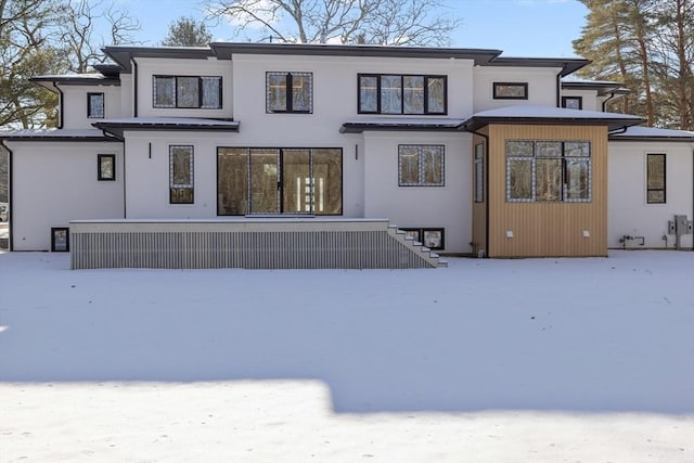 view of snow covered house