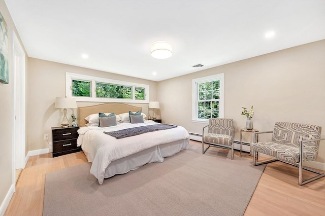 27 Lantern Ln, Arlington, MA 02474 - bedroom with light wood finished floors, baseboards, and recessed lighting