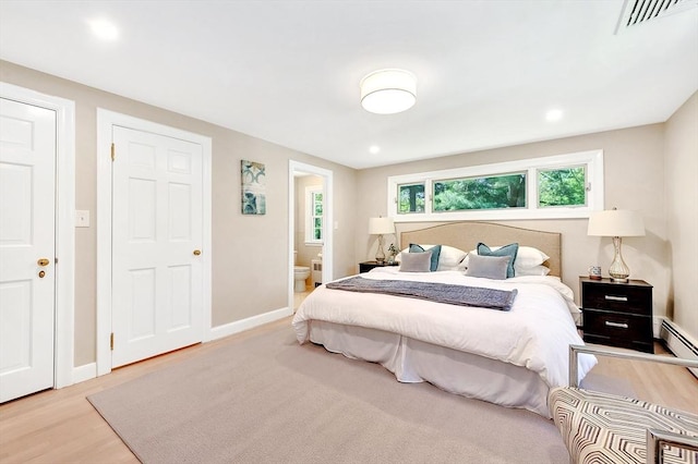 27 Lantern Ln, Arlington, MA 02474 - bedroom featuring wood finished floors, baseboards, ensuite bathroom, and recessed lighting