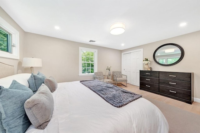 27 Lantern Ln, Arlington, MA 02474 - bedroom with light wood-style flooring, a closet, recessed lighting, and baseboards