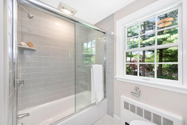 27 Lantern Ln, Arlington, MA 02474 - bathroom with radiator heating unit, combined bath / shower with glass door, plenty of natural light, and marble finish floors