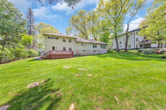 27 Lantern Ln, Arlington, MA 02474 - back of property featuring a wooden deck and a yard