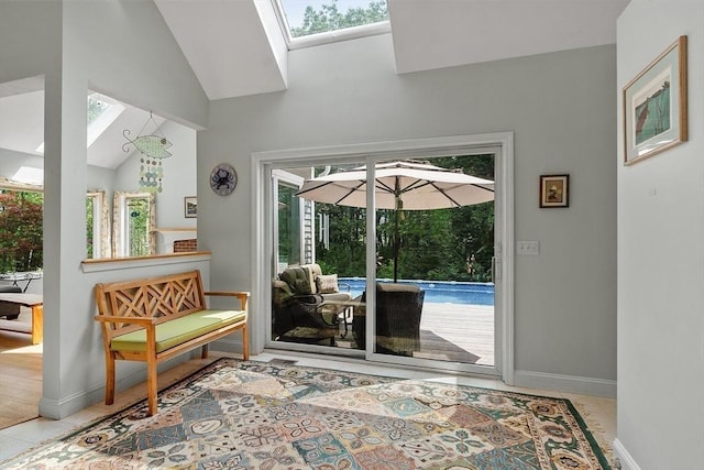 7 Humiston Cir, Westford, MA 01886 - doorway to outside featuring baseboards, lofted ceiling, a skylight, and tile patterned floors