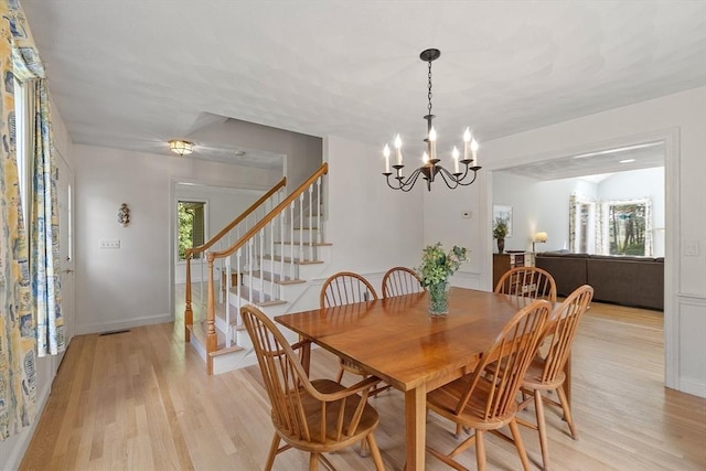 7 Humiston Cir, Westford, MA 01886 - dining area with light wood-style floors, stairway, a chandelier, and baseboards