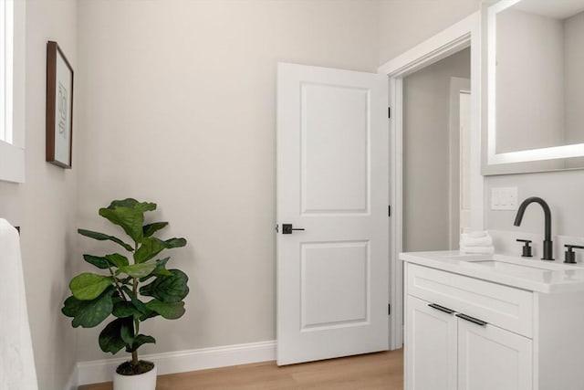 1 Cross St Unit 205, Wilmington, MA 01887 - bathroom with wood finished floors, vanity, and baseboards
