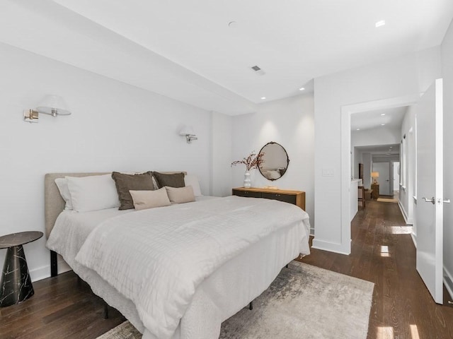 bedroom featuring dark hardwood / wood-style flooring