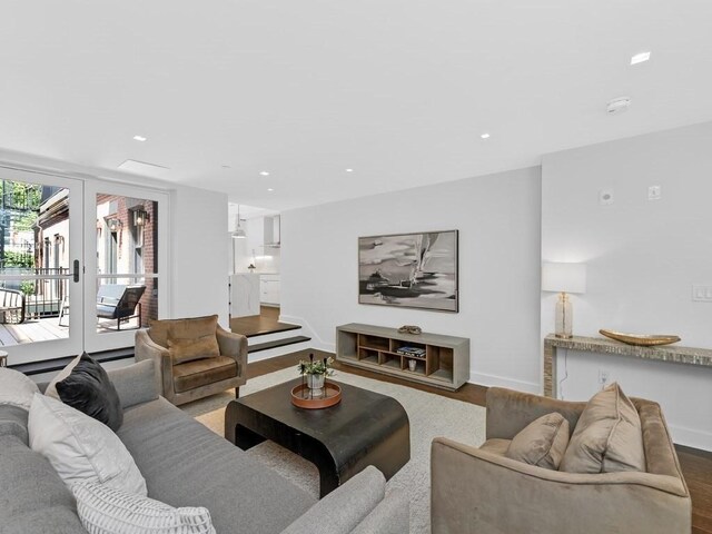 living room featuring french doors and hardwood / wood-style floors