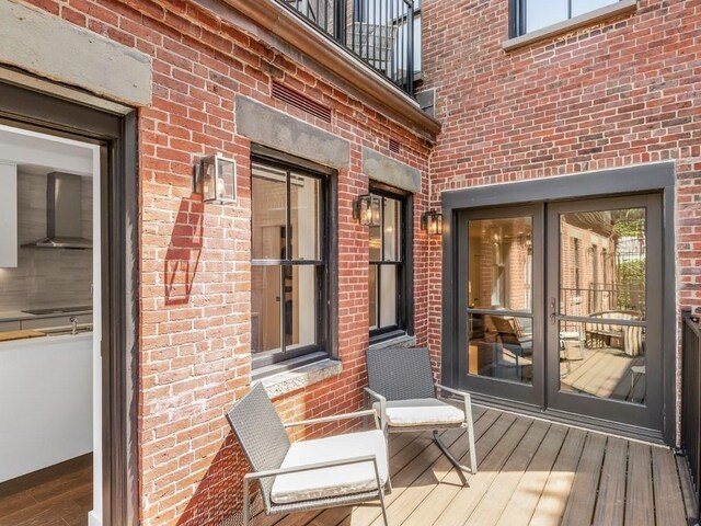 wooden deck featuring sink