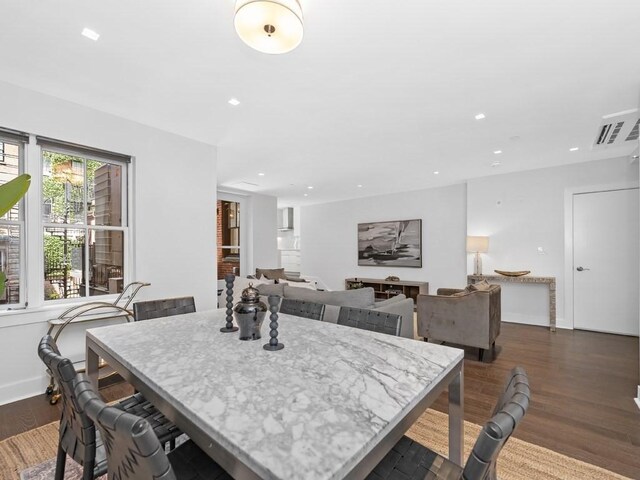 dining room with dark hardwood / wood-style floors