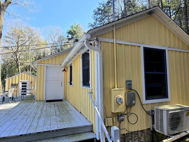 60 Camp Rd, Leverett, MA 01054 - exterior space with board and batten siding, ac unit, a wooden deck, and a shed