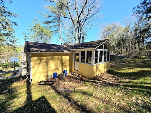 60 Camp Rd, Leverett, MA 01054 - rear view of house featuring a sunroom