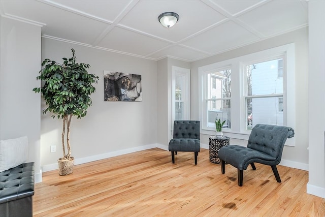 living area featuring wood-type flooring and coffered ceiling