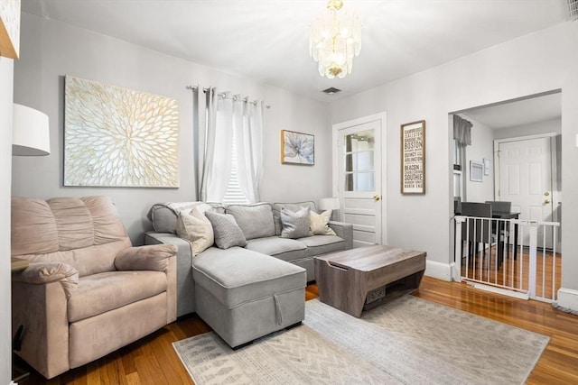 5 Hinckley St Unit 2, Somerville, MA 02145 - living area featuring wood finished floors and a chandelier