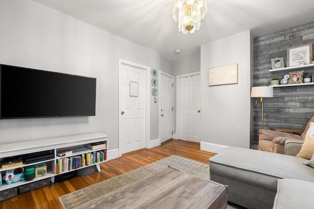5 Hinckley St Unit 2, Somerville, MA 02145 - living area featuring wood finished floors and a chandelier