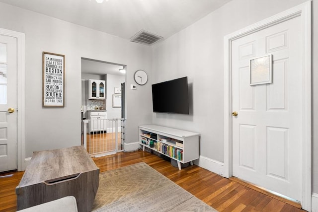 5 Hinckley St Unit 2, Somerville, MA 02145 - living area featuring dark wood-style floors and baseboards