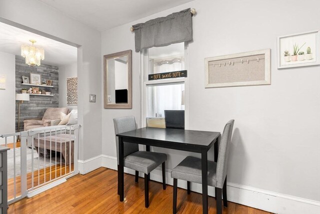 5 Hinckley St Unit 2, Somerville, MA 02145 - dining area featuring wood finished floors and a chandelier