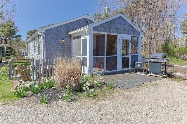 rear view of house with a sunroom